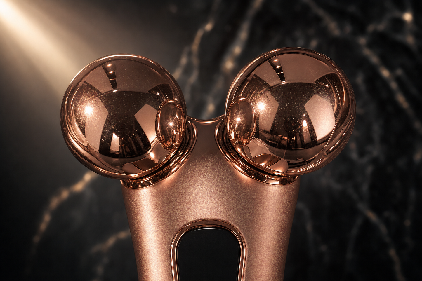 Closeup of Lumis Lift EMS Wand, a microcurrent skincare device from Lumis Beauty with sleek design and textured handle.